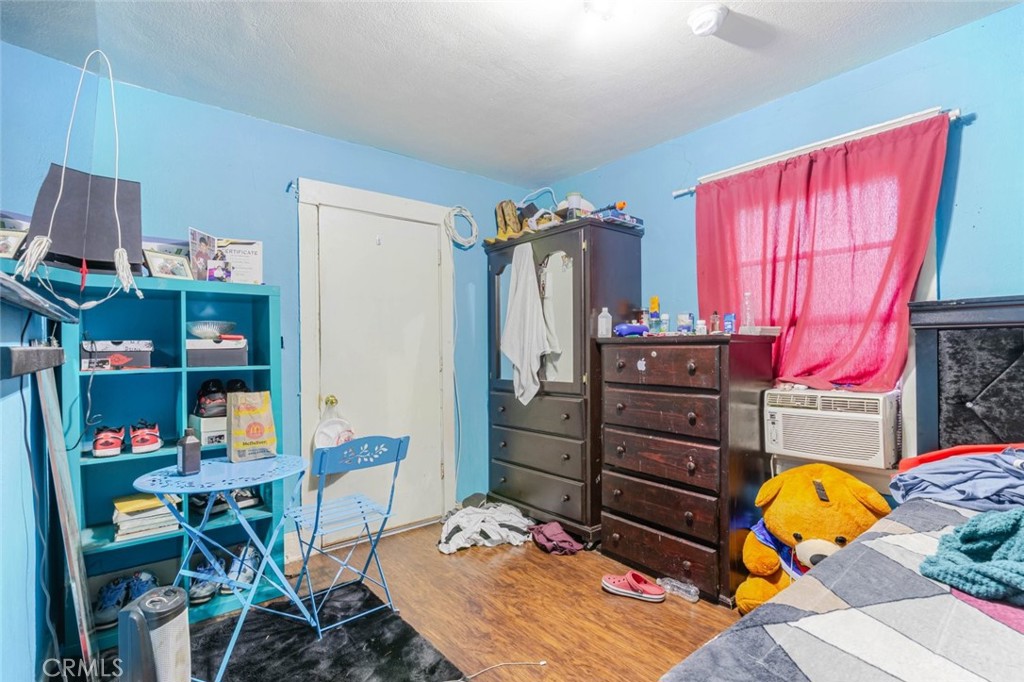 811 East 43rd Place Los Angeles, CA 90011 - Photo 22 of 31 a bed room with a bed and a furniture