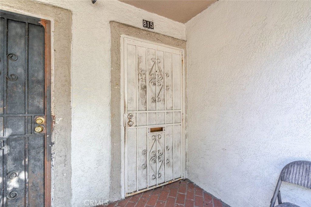 811 East 43rd Place Los Angeles, CA 90011 - Photo 25 of 31 a view of a hallway with wooden floor and entryway