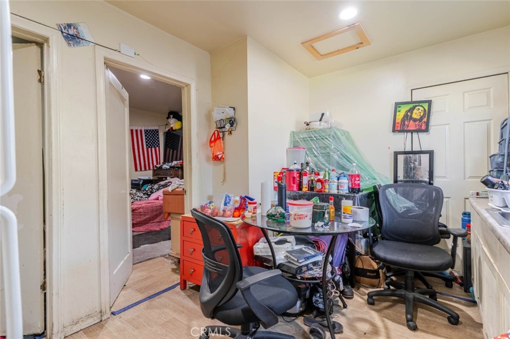 811 East 43rd Place Los Angeles, CA 90011 - Photo 27 of 31 a dining room with furniture and a chandelier fan