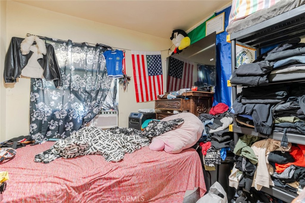811 East 43rd Place Los Angeles, CA 90011 - Photo 29 of 31 a view of walk in closet with clothes and shoes