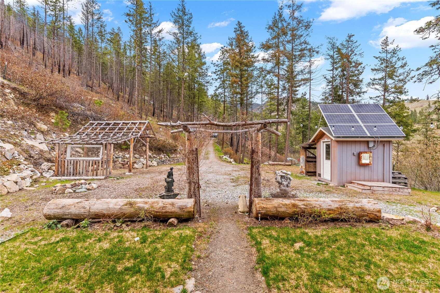 109 Granite Falls Road Chelan, WA 98816 - Photo 16 of 22 a view of a house with a yard