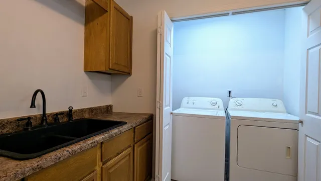 a view of storage and utility room with a sink