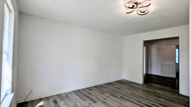 a view of a livingroom with wooden floor