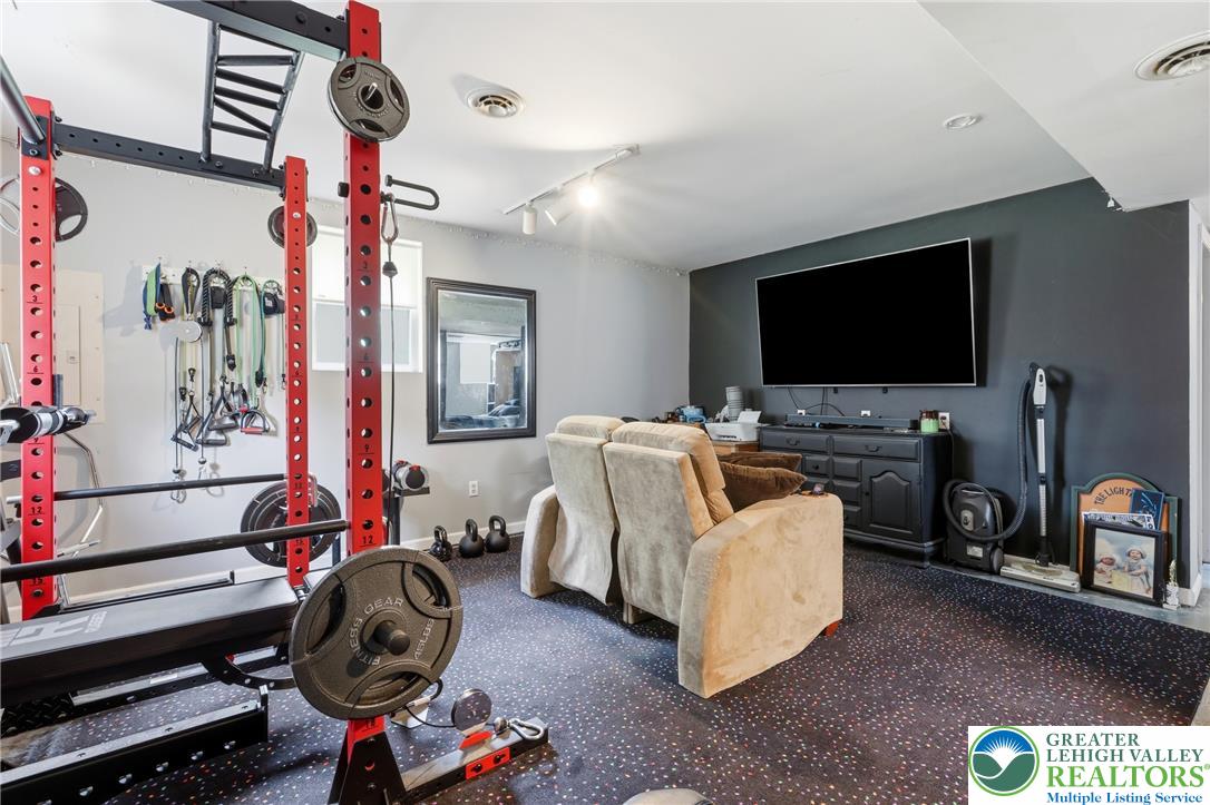 732 Bushkill Center Road Nazareth, PA 18064 - Photo 22 of 43 Dedicate a well-lit space to personal wellness with this adaptable home gym, perfect for focused workouts and relaxation.