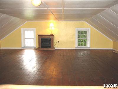 3819 Fairfax Road Bethlehem, PA 18020 - Photo 4 of 7 This lovely 3rd floor has wide plank wood floors, gas fireplace, as well as great views of the oasis in the yard. This could also be converted into a Master BR suite, additional BR's as well as office or family room etc.