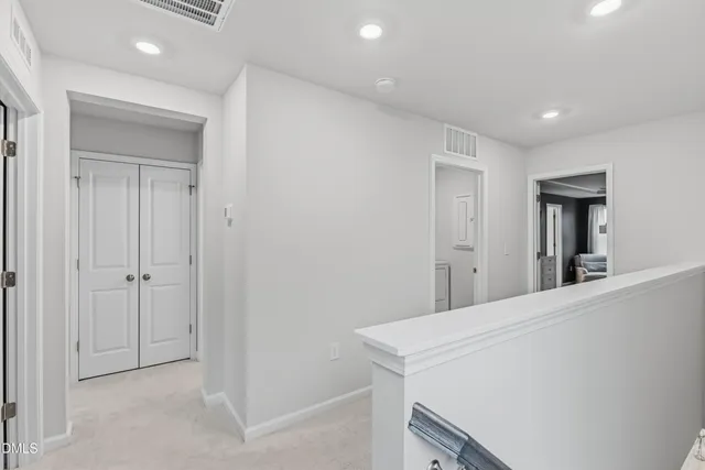 a room with a bed and a mirror