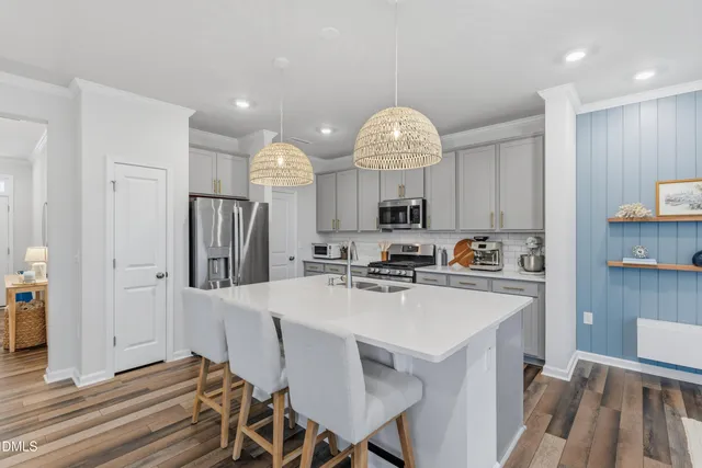 a bathroom with a sink a mirror and a window