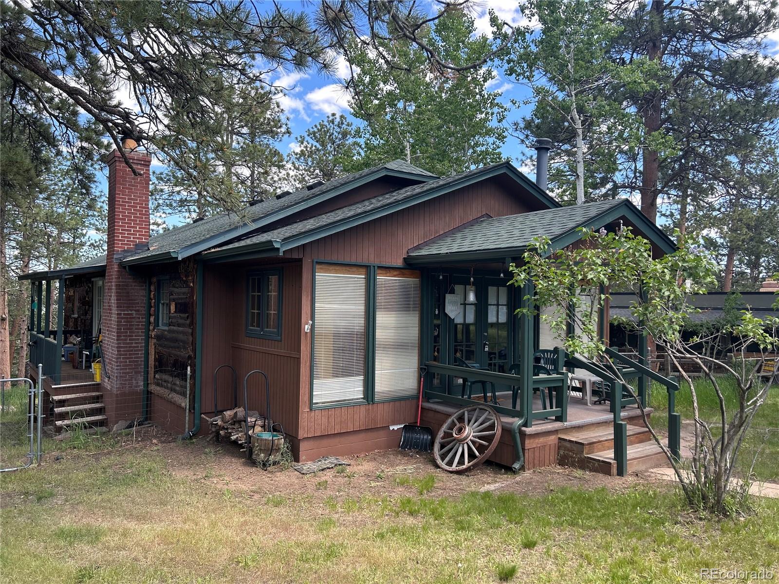 4393 South Pima Road Indian Hills, CO 80454 - Photo 2 of 12 a view of outdoor space yard and porch