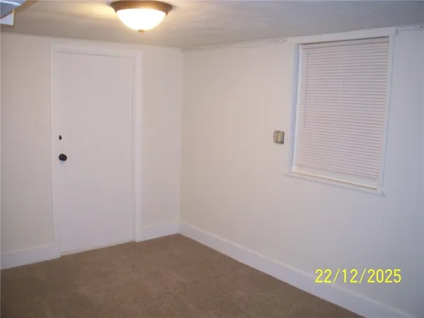 a view of a hallway with a white walls