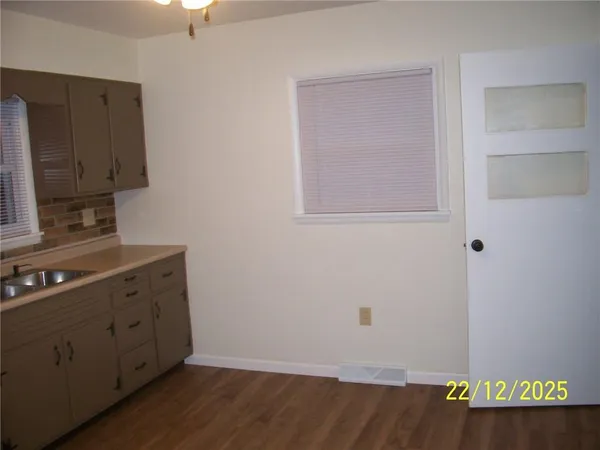 a view of cabinets with wooden floor