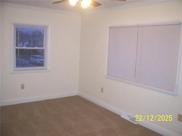 an empty room with a fan