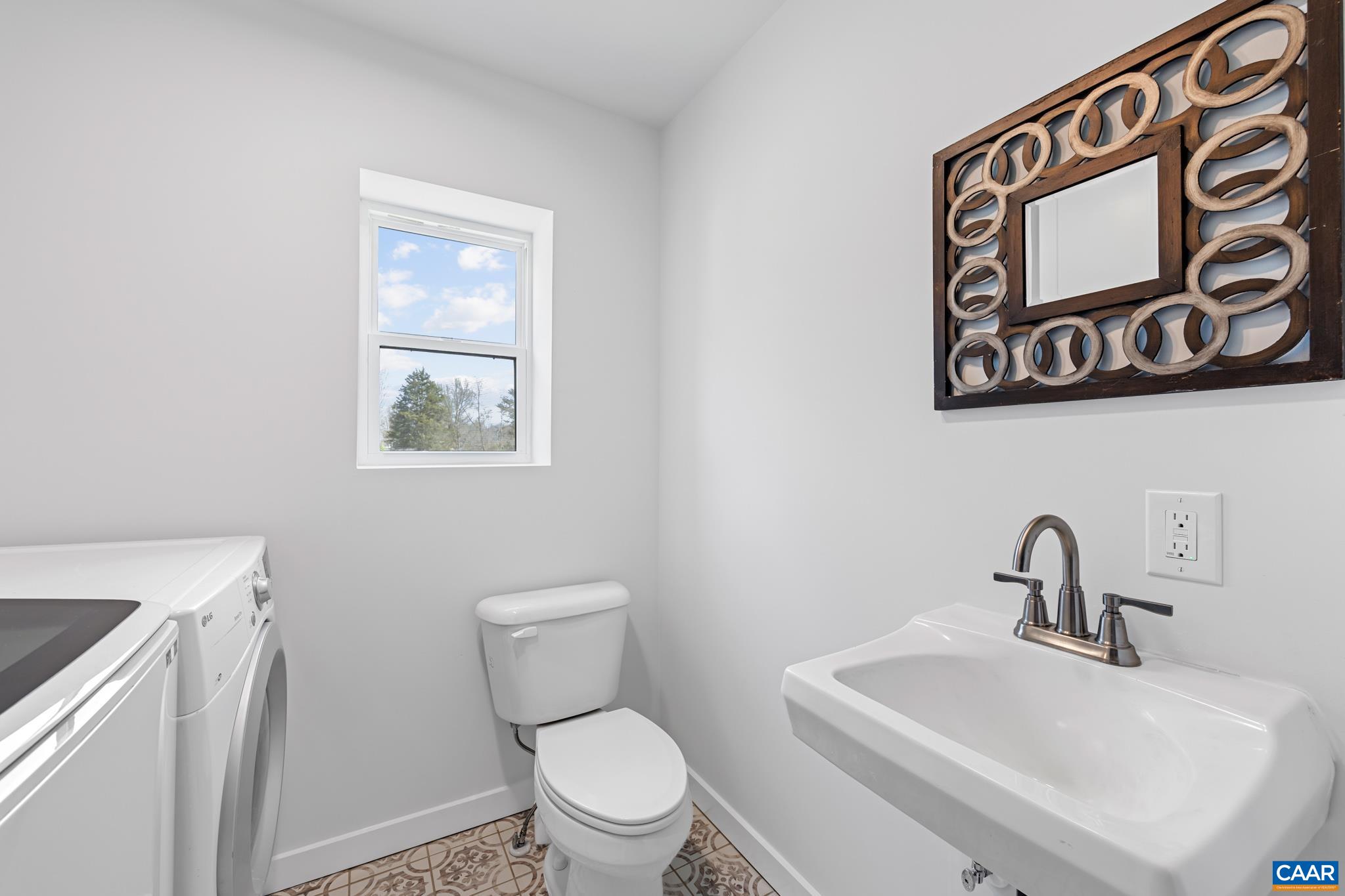 2733 Cedar Lane Road Kents Store, VA 23084 - Photo 24 of 43 Conveniently located on the main level, the half bath also features a first floor laundry area, eliminating the need to carry laundry up and down the stairs or access the basement. This thoughtful layout adds everyday ease and functionality