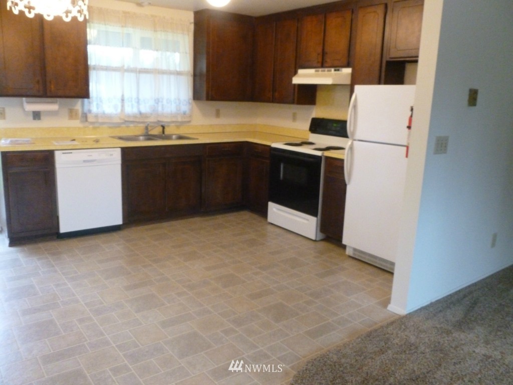 8440 178th Avenue Southwest Rochester, WA 98579 - Photo 5 of 15 a kitchen with stainless steel appliances granite countertop a sink stove and refrigerator