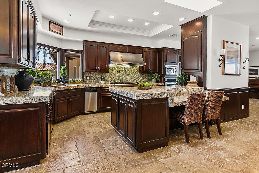 95 Avocado Place Camarillo, CA 93010 - Photo 11 of 74 a kitchen with a sink stove and cabinets