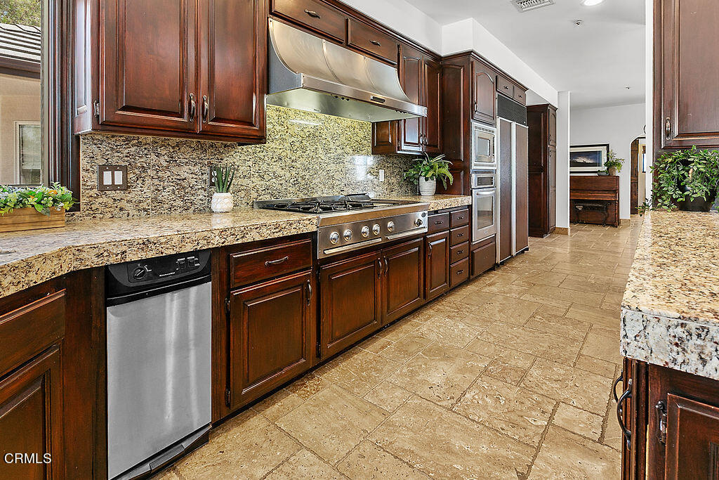 95 Avocado Place Camarillo, CA 93010 - Photo 14 of 74 a kitchen with stainless steel appliances granite countertop a stove a sink and a microwave