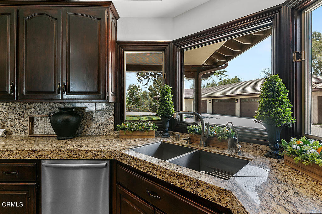 95 Avocado Place Camarillo, CA 93010 - Photo 16 of 74 a kitchen with sink refrigerator and cabinets