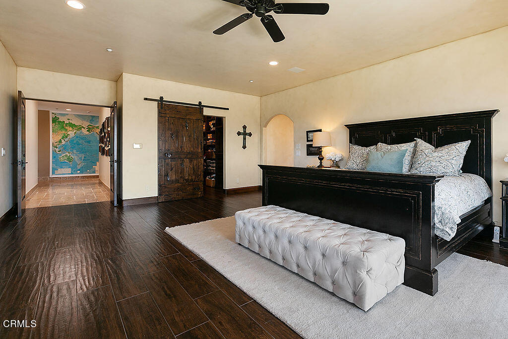 95 Avocado Place Camarillo, CA 93010 - Photo 25 of 74 a bedroom with a bed and wooden floor