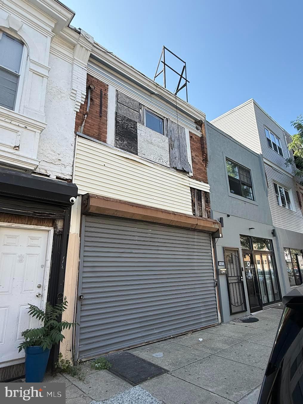 a front view of a house with large windows