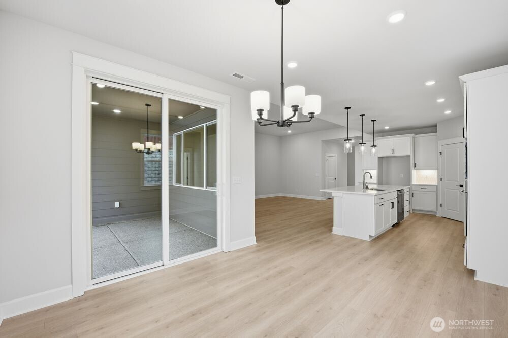 2609 Acer Loop Southeast Lacey, WA 98513 - Photo 8 of 28 a view of a kitchen and windows