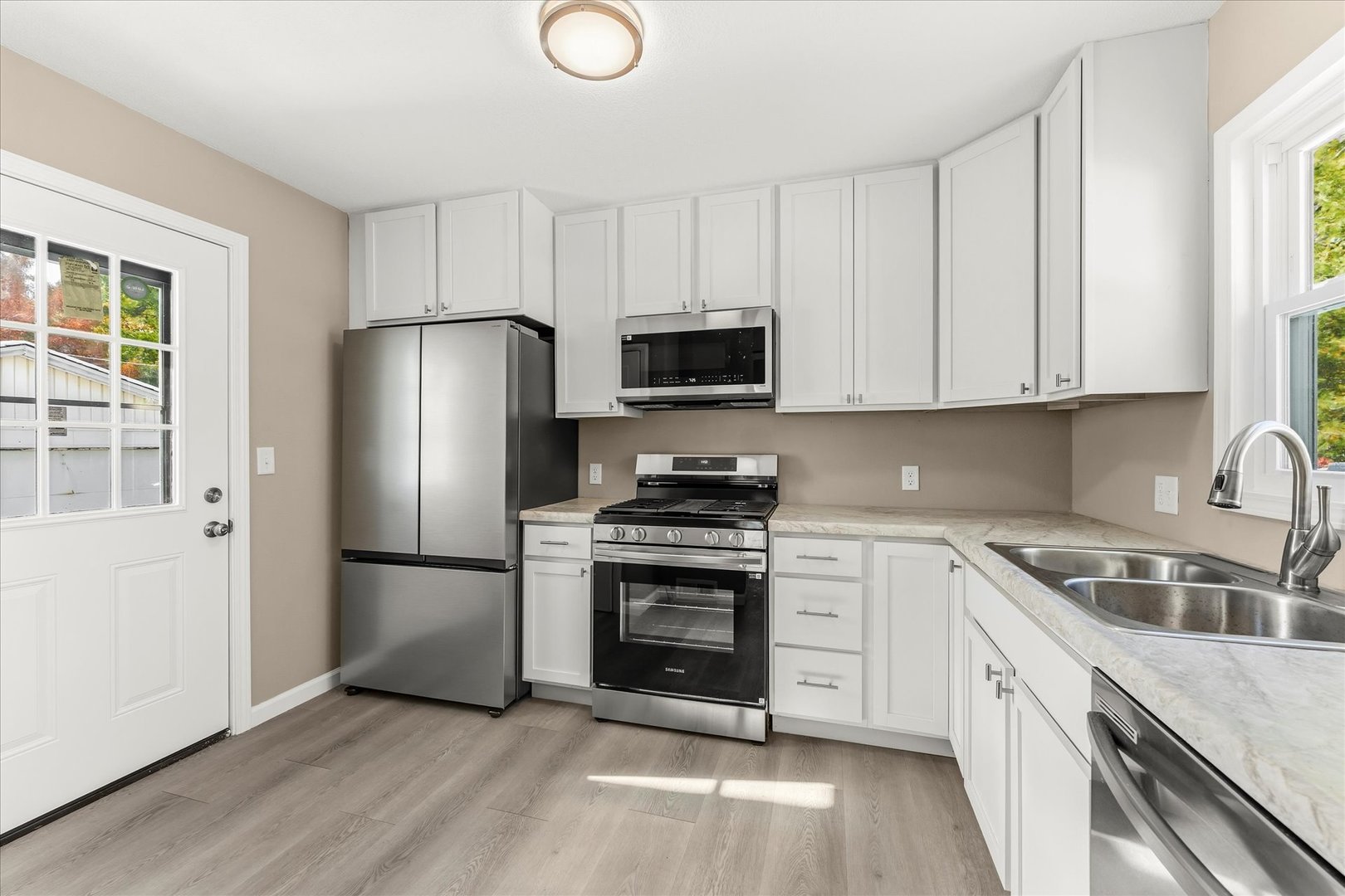 1407 West Clark Street Champaign, IL 61821 - Photo 11 of 28 a kitchen with a sink stove and refrigerator