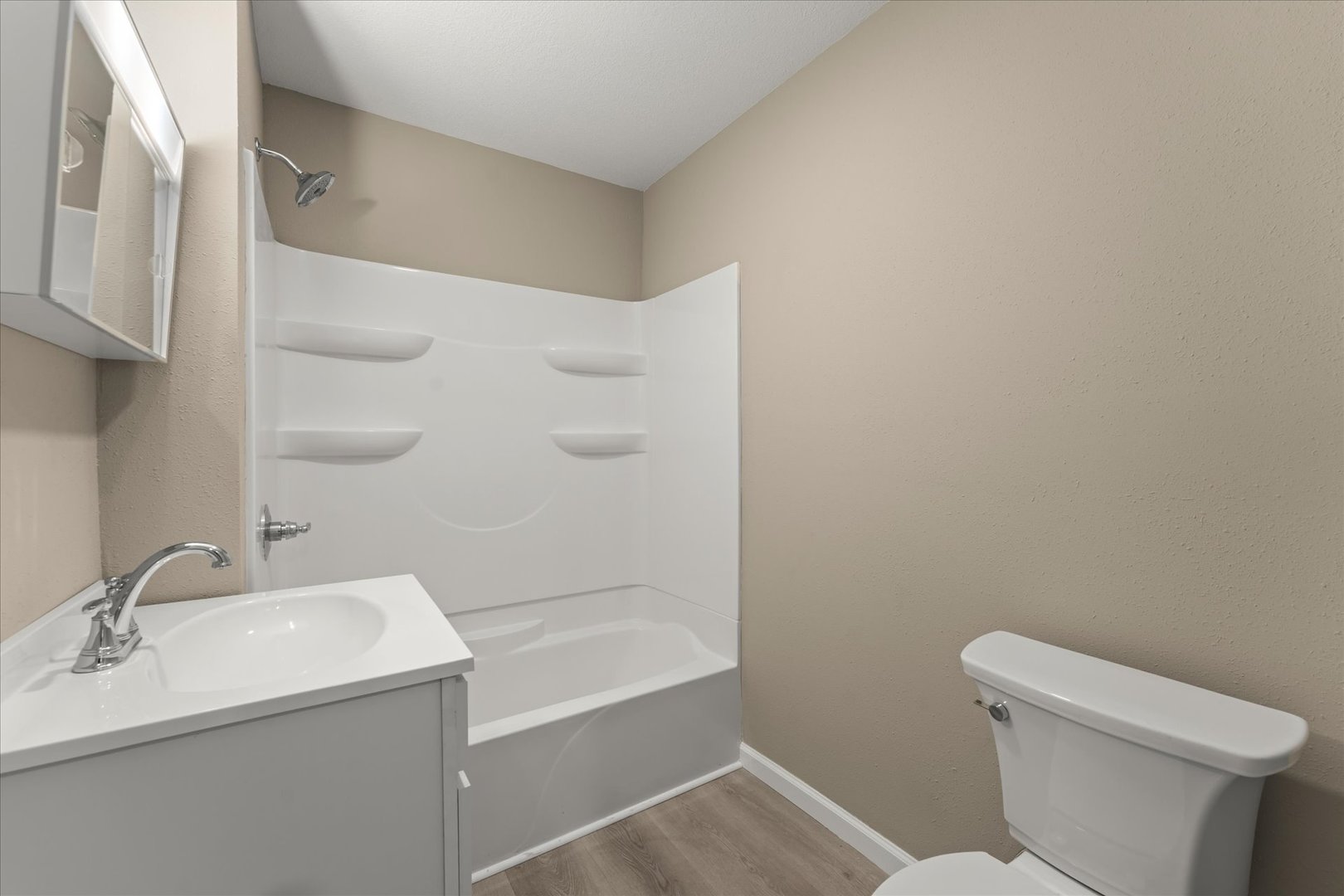 1407 West Clark Street Champaign, IL 61821 - Photo 14 of 28 a bathroom with a sink toilet and shower