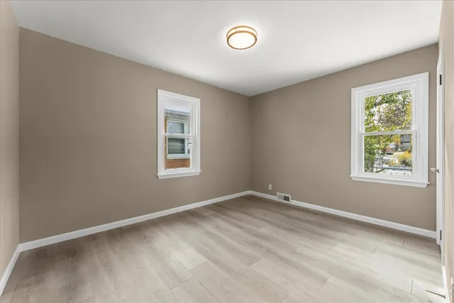 a view of room with window and ceiling fan