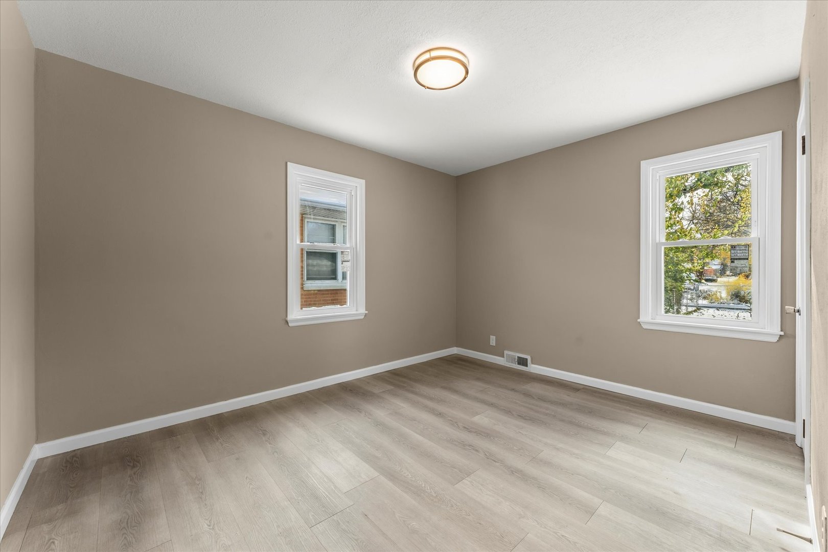 1407 West Clark Street Champaign, IL 61821 - Photo 16 of 28 a view of room with window and ceiling fan