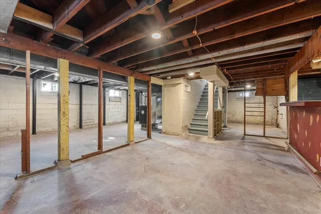 a view of empty room with wooden ceiling