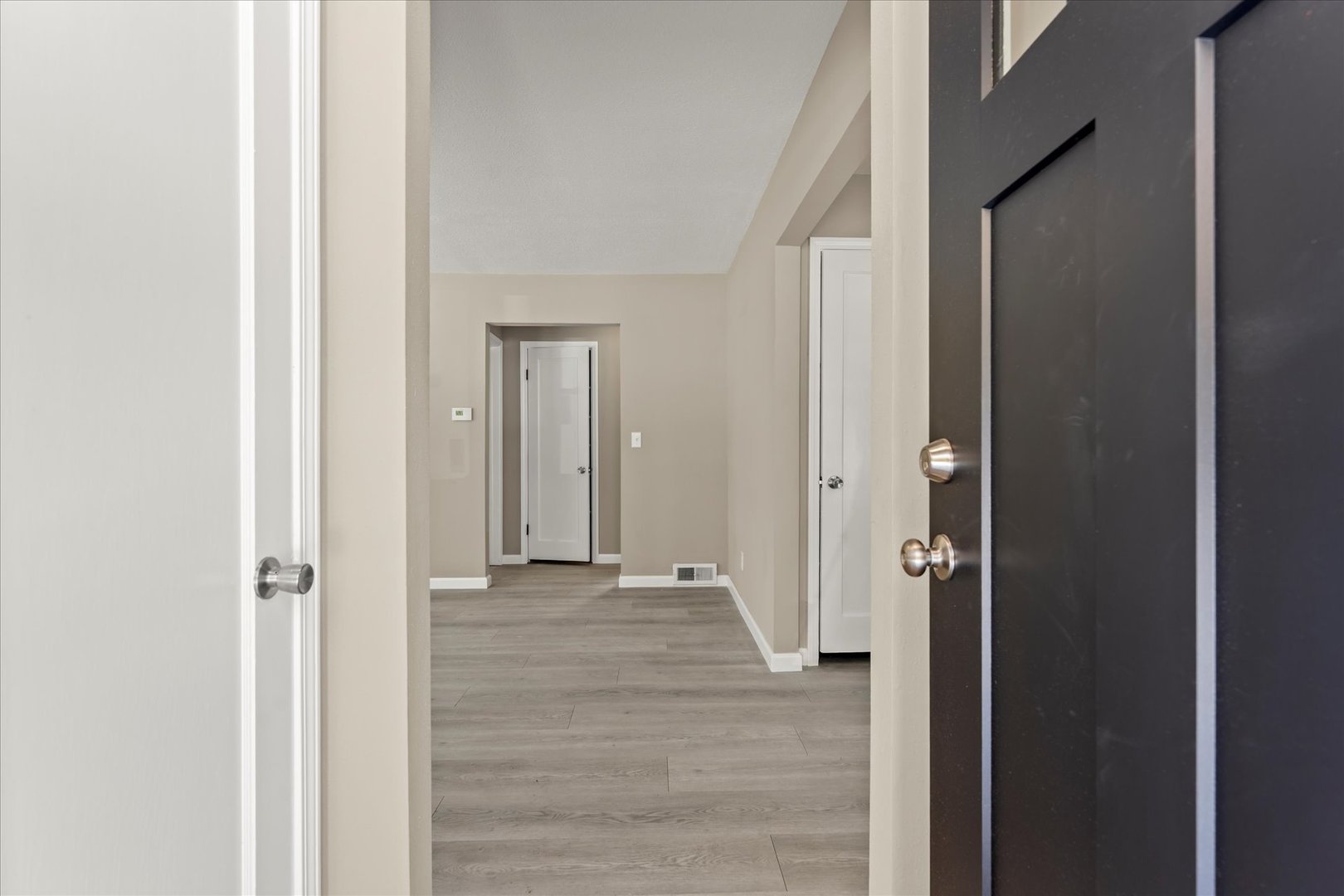 1407 West Clark Street Champaign, IL 61821 - Photo 5 of 28 a view of a hallway with wooden floor