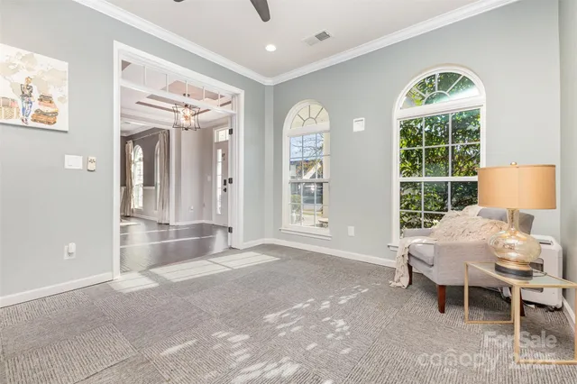 a view of a livingroom with furniture and window