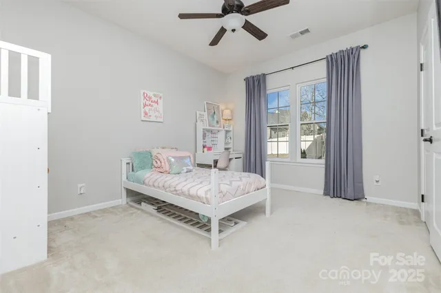 a bed room with a bed and window