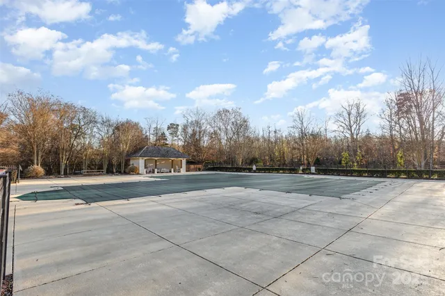 a view of a fountain in front of a house