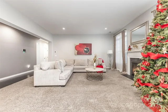 a living room with furniture and flowers