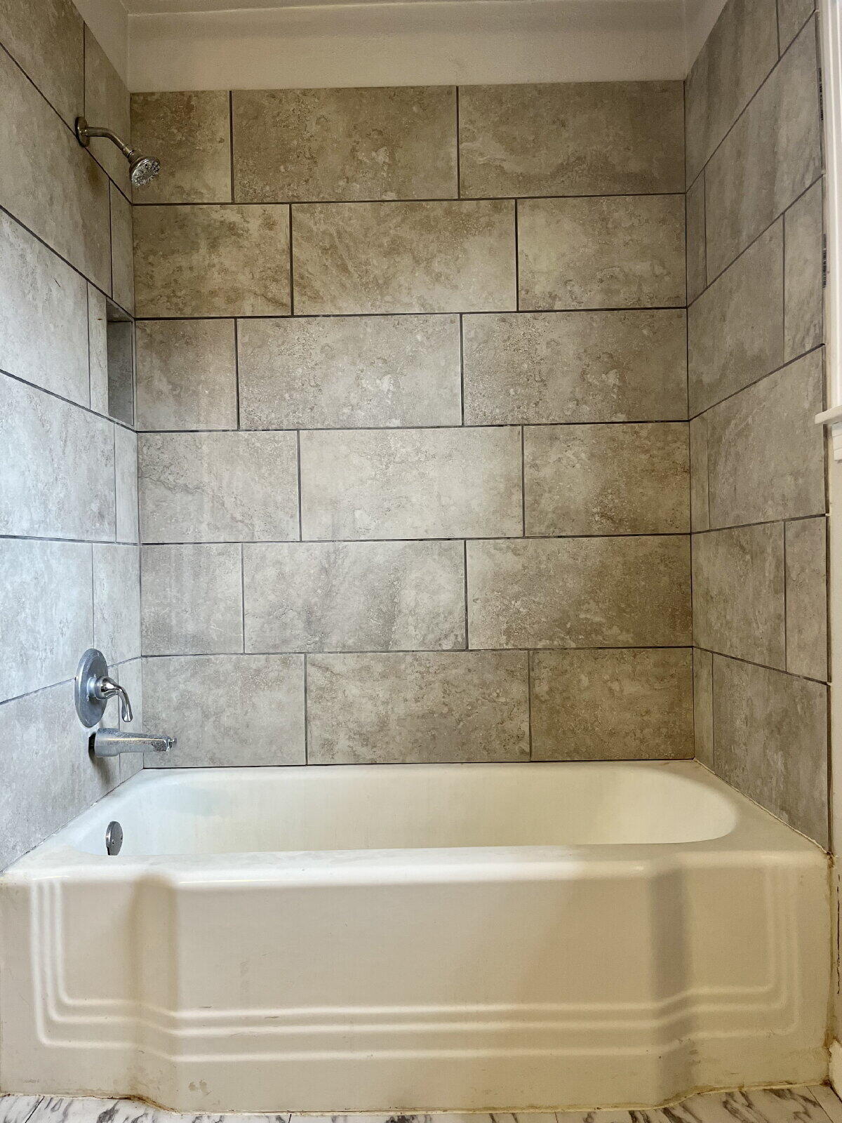 3414 24th Street, Unit FRONT Lubbock, TX 79410 - Photo 15 of 21 a bathroom with a bathtub