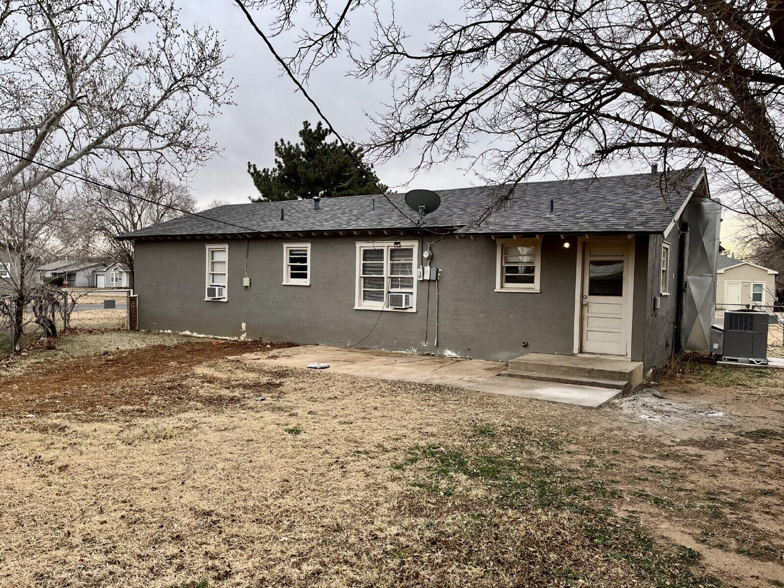 3414 24th Street, Unit FRONT Lubbock, TX 79410 - Photo 20 of 21 a view of a house with a yard