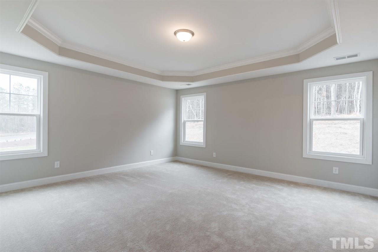 57 Ravencliff Ridge Garner, NC 27529 - Photo 15 of 25 an empty room with a window