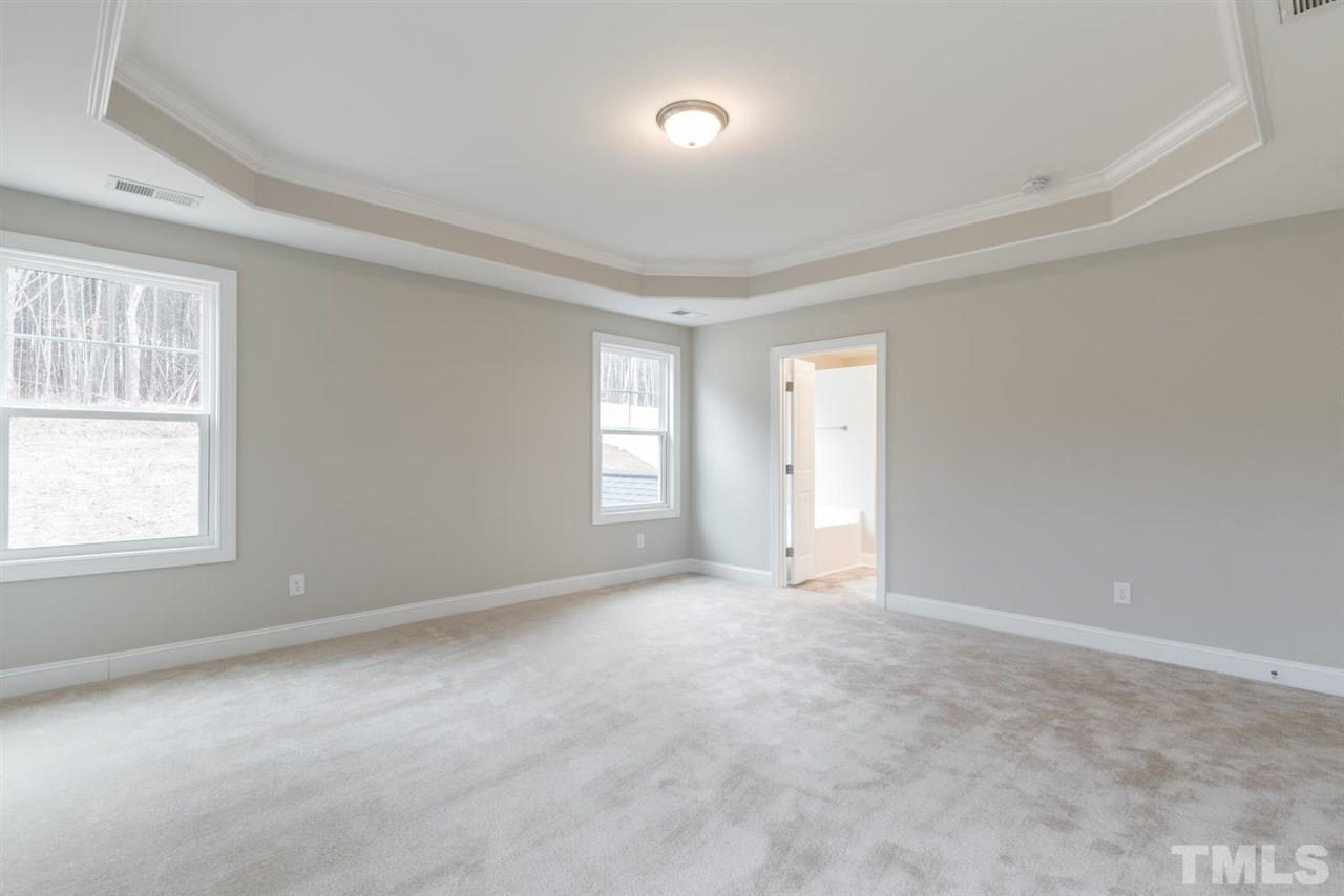 57 Ravencliff Ridge Garner, NC 27529 - Photo 16 of 25 an empty room with windows