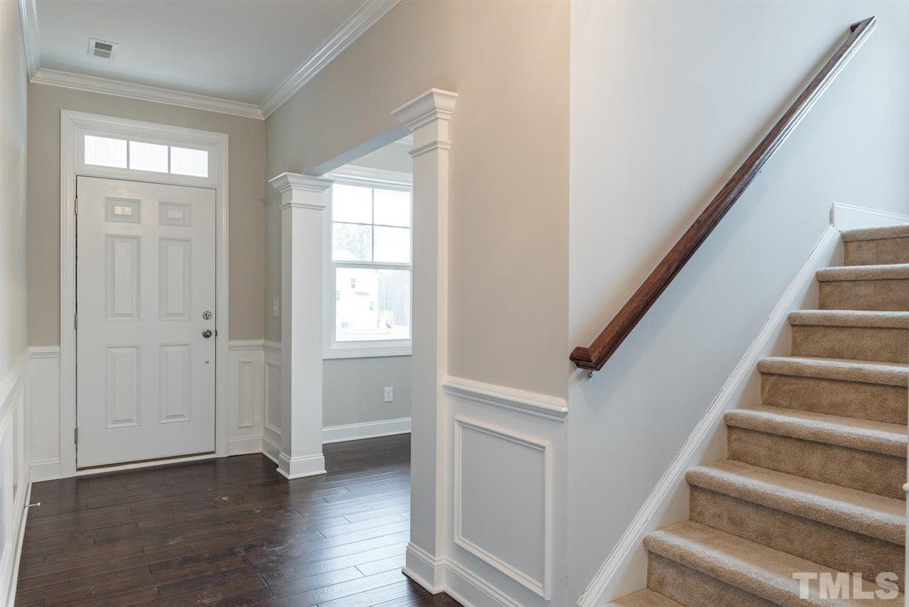 57 Ravencliff Ridge Garner, NC 27529 - Photo 3 of 25 a view of an entryway with wooden floor