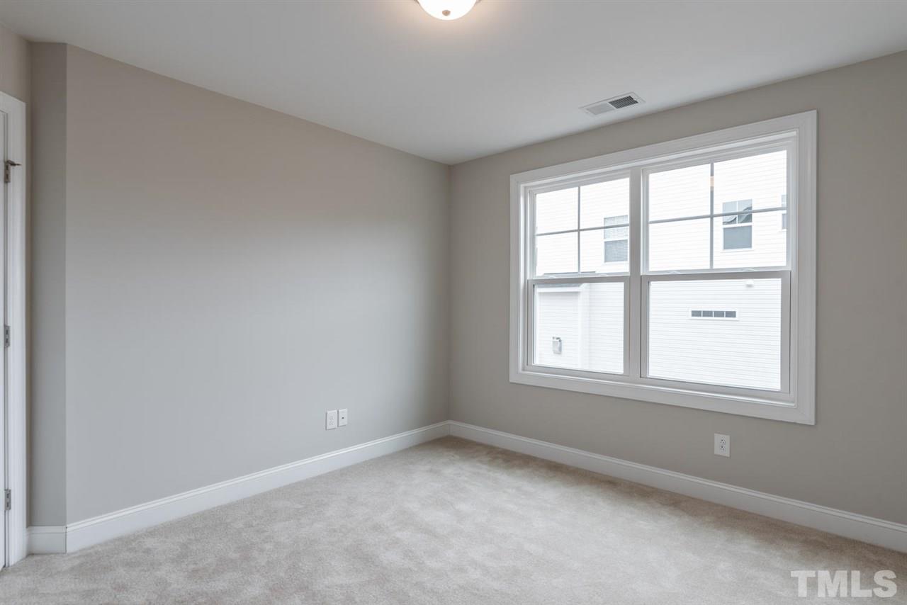 57 Ravencliff Ridge Garner, NC 27529 - Photo 21 of 25 an empty room with a window