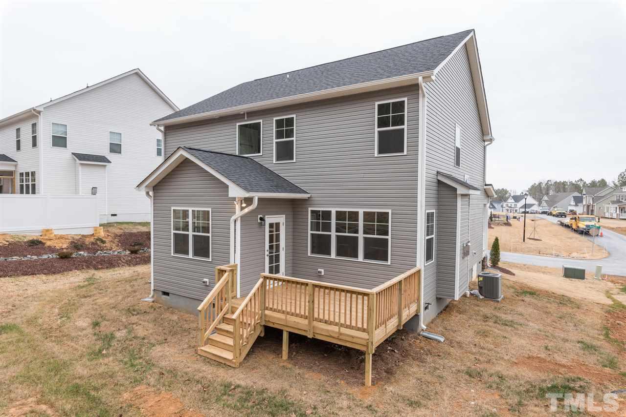 57 Ravencliff Ridge Garner, NC 27529 - Photo 23 of 25 a front view of a house with a yard