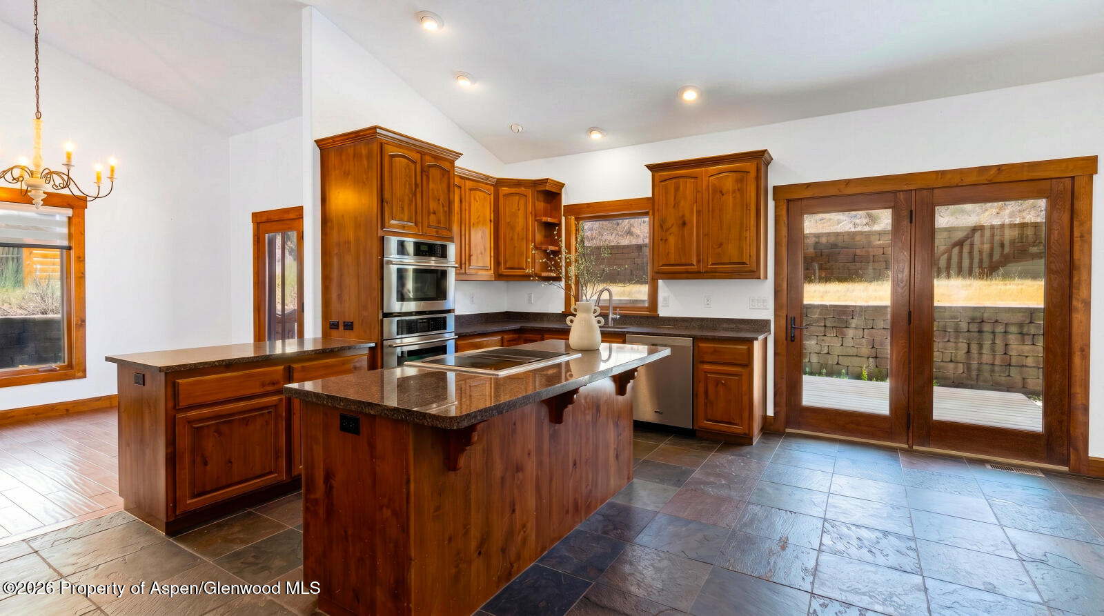 316 Faas Ranch Road New Castle, CO 81647 - Photo 10 of 50 a kitchen with stainless steel appliances granite countertop a stove a sink and a refrigerator