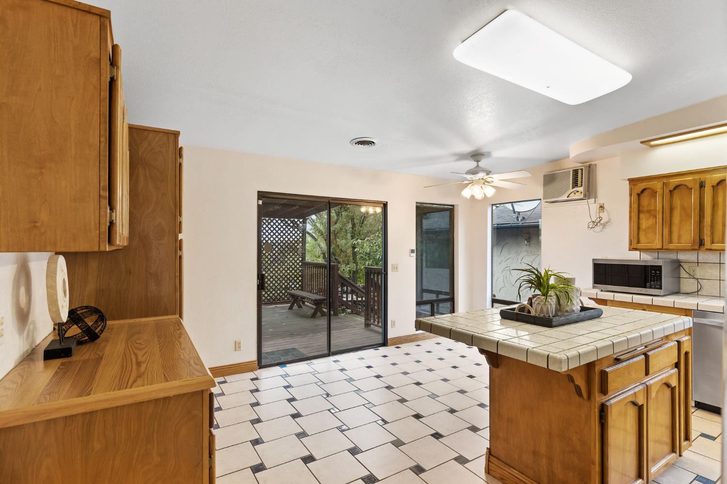 225 Flood Road Auburn, CA 95603 - Photo 12 of 30 a kitchen with a sink and refrigerator