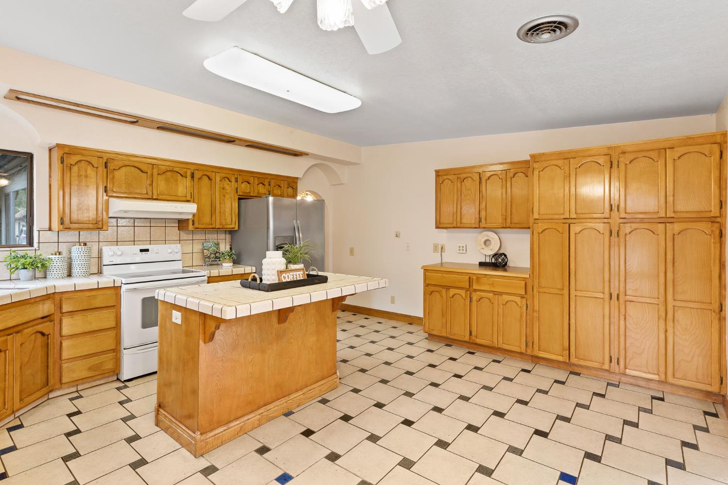 225 Flood Road Auburn, CA 95603 - Photo 14 of 30 a kitchen with a sink stove and refrigerator