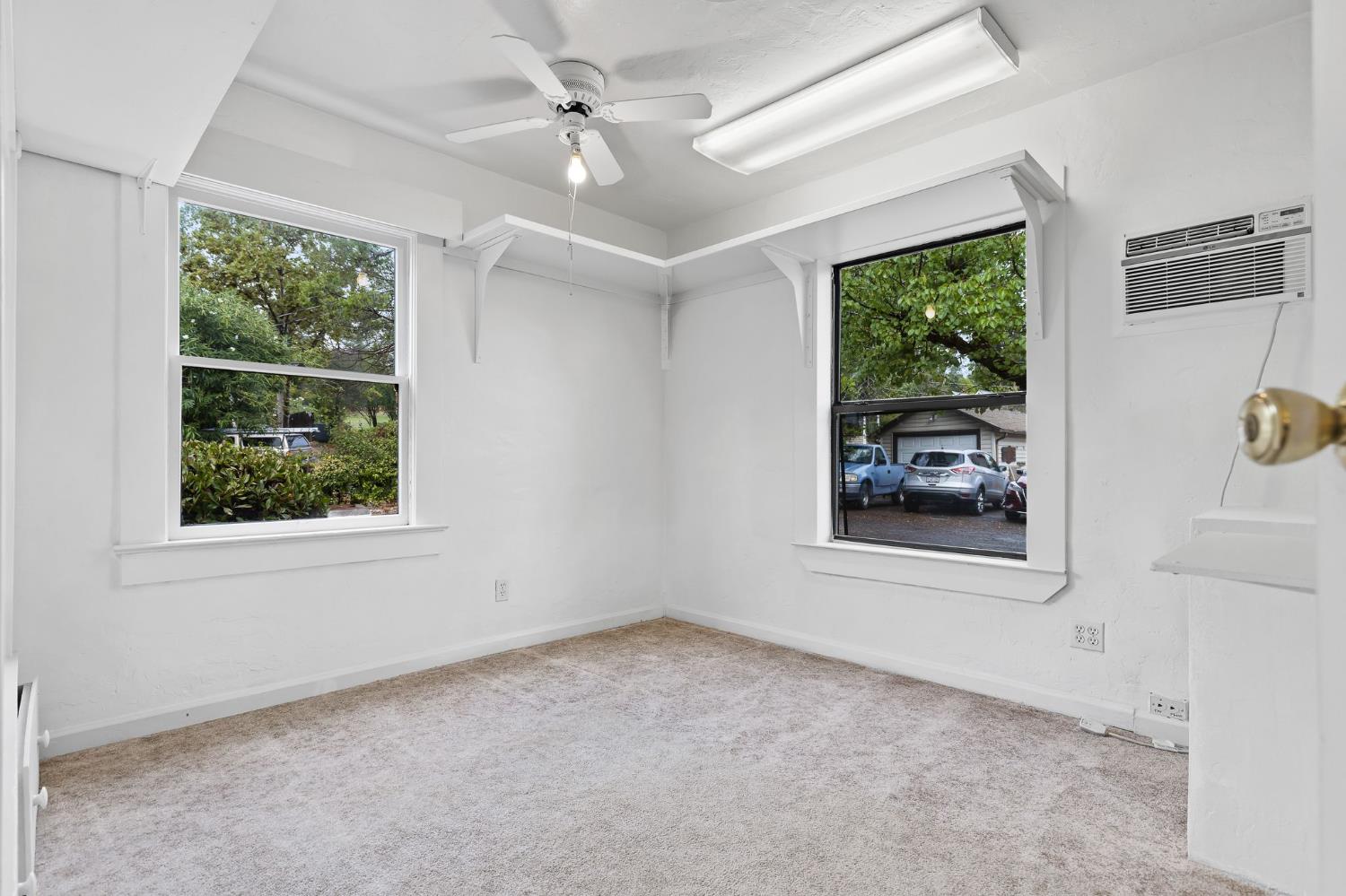 225 Flood Road Auburn, CA 95603 - Photo 16 of 30 an empty room with windows and ceiling fan