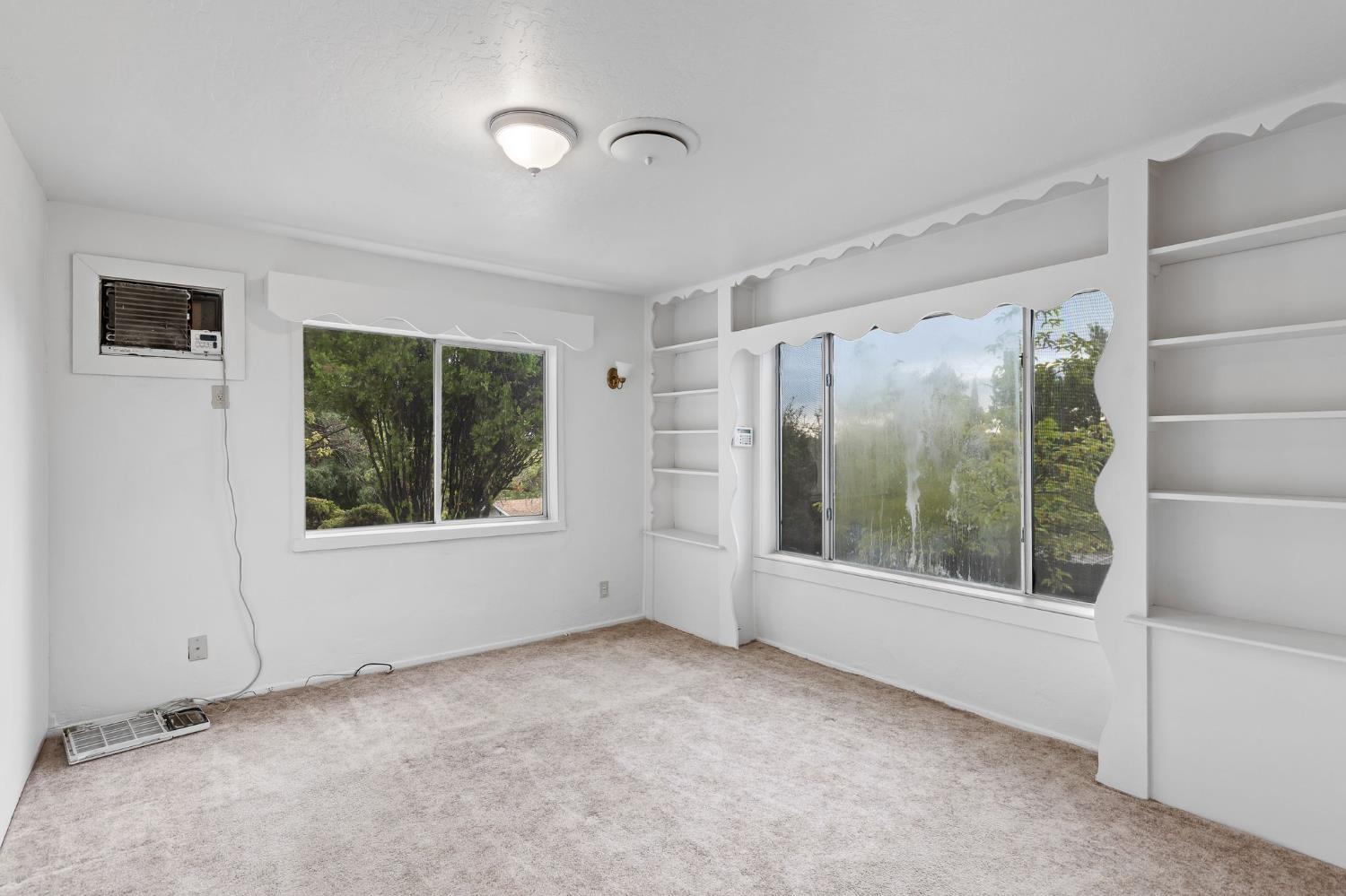 225 Flood Road Auburn, CA 95603 - Photo 22 of 30 a view of an empty room with a window
