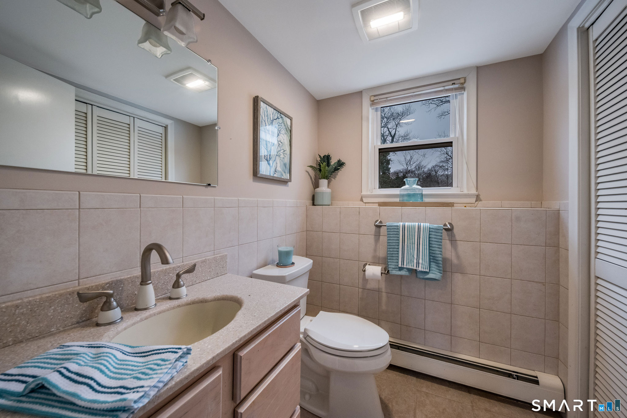 40 Puritan Lane Madison, CT 06443 - Photo 31 of 39 Lower Level Half Bath and Laundry