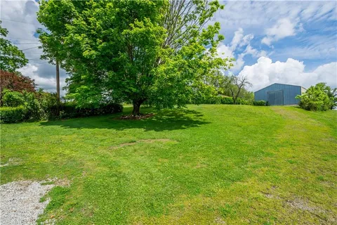 a backyard of a house with lots of green space