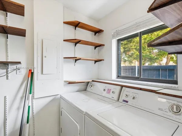 a utility room with dryer and washer
