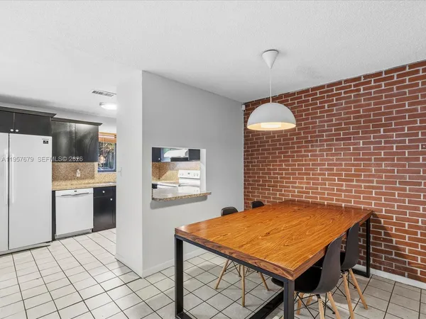 a room with a table and chairs