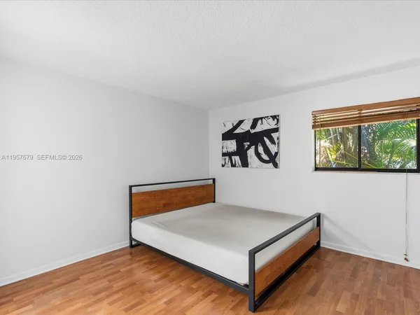 a room with a bed and a window